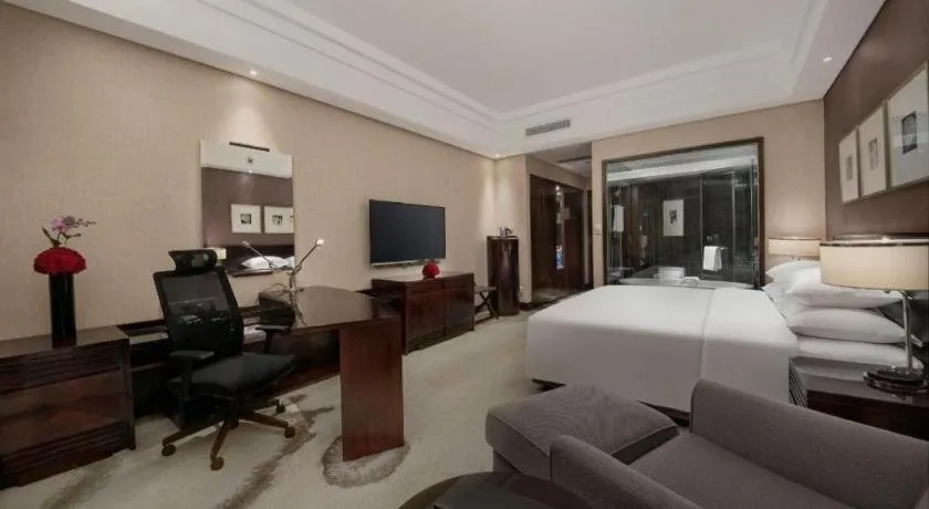 Bed in New Century Hangzhou Grand Hotel