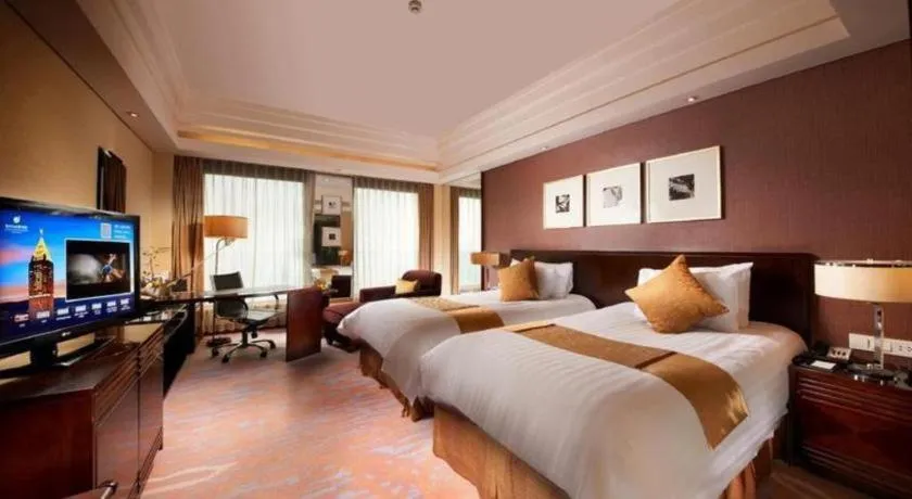 Bed in New Century Hangzhou Grand Hotel