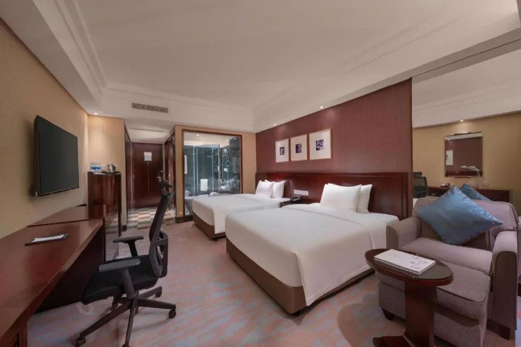 Bed in New Century Hangzhou Grand Hotel