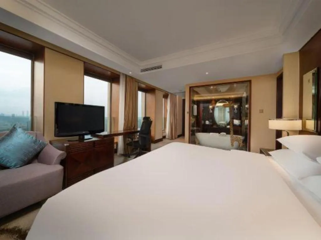 Bed in New Century Hangzhou Grand Hotel