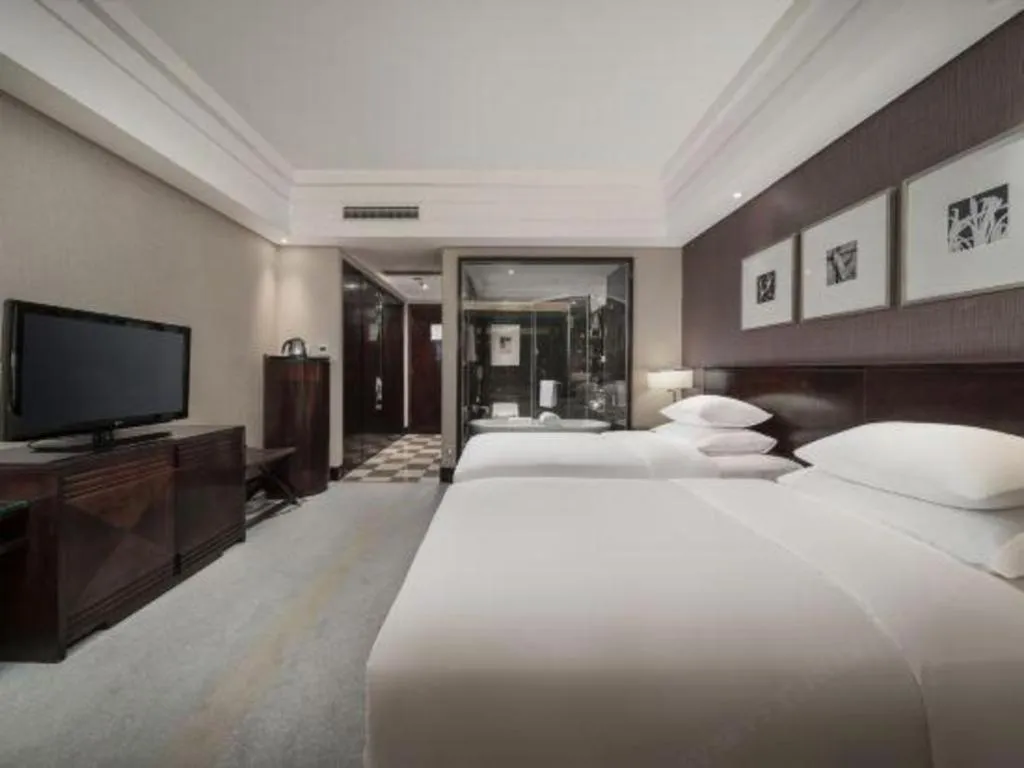Bed in New Century Hangzhou Grand Hotel