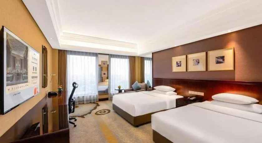Bed in New Century Hangzhou Grand Hotel