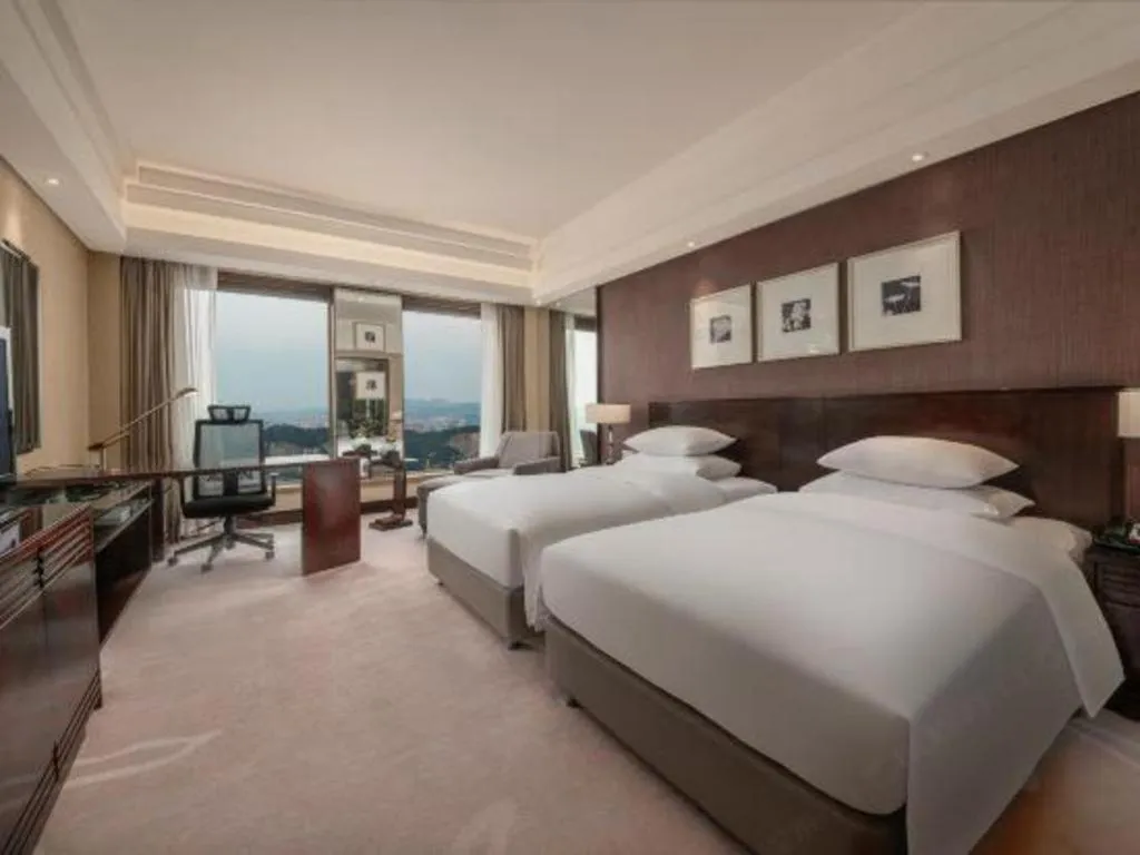 Bed in New Century Hangzhou Grand Hotel