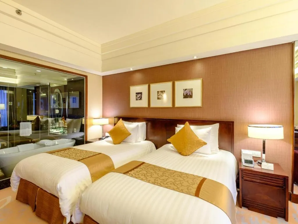 Bed in New Century Hangzhou Grand Hotel