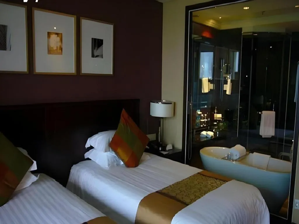 Bed in New Century Hangzhou Grand Hotel