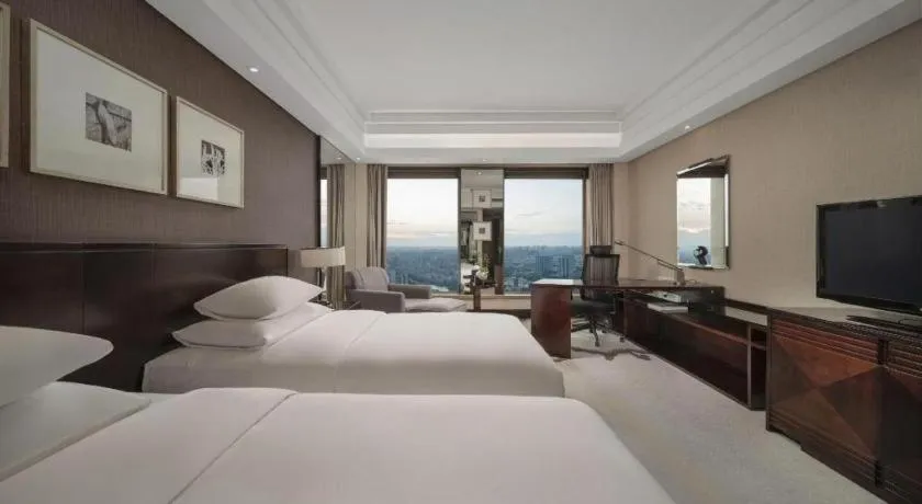 Bed in New Century Hangzhou Grand Hotel