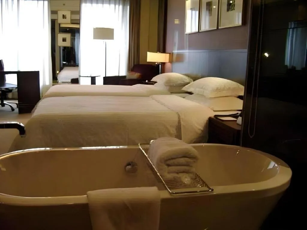 Bed in New Century Hangzhou Grand Hotel