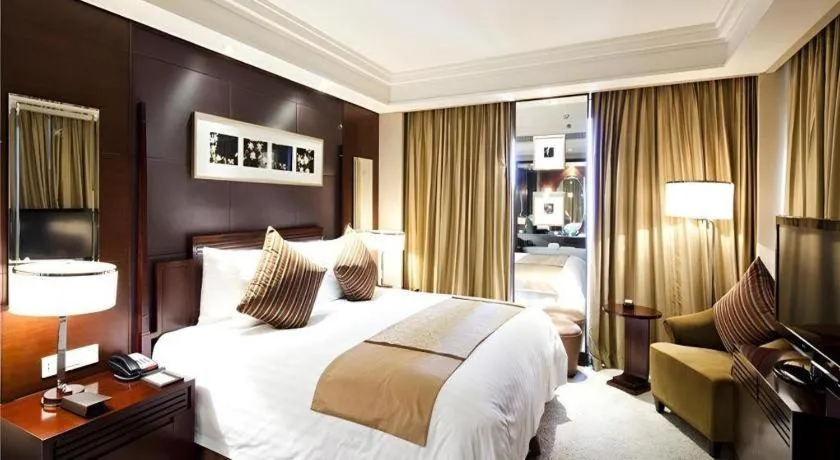 Bed in New Century Hangzhou Grand Hotel