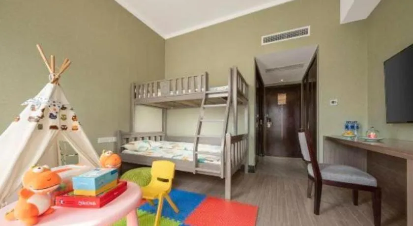 Bed in New Century Hangzhou Grand Hotel