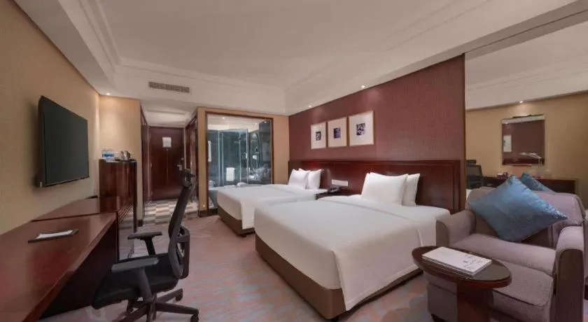 Bed in New Century Hangzhou Grand Hotel