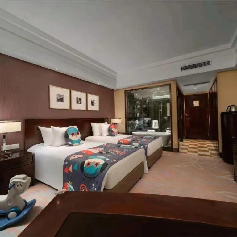 Bed in New Century Hangzhou Grand Hotel