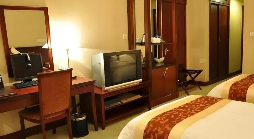 Bed in New Century Hotel Ninghai