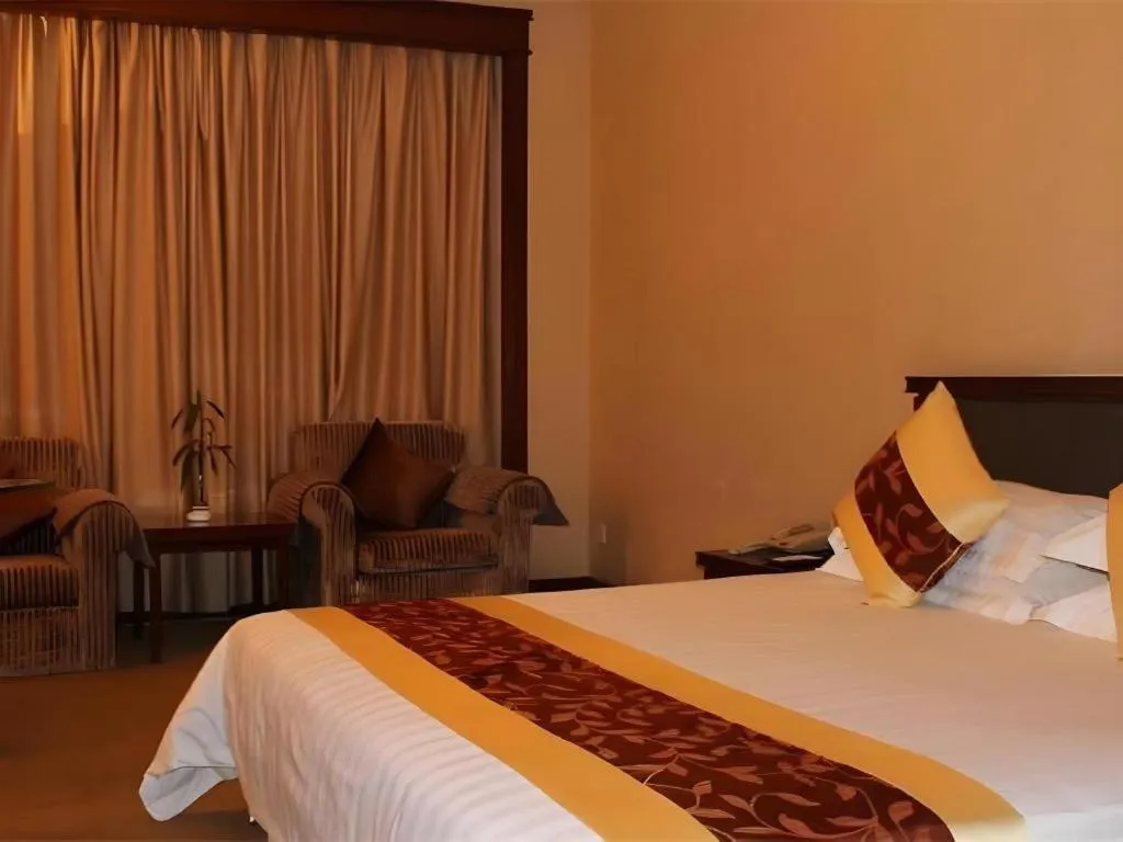 Bed in New Century Hotel Ninghai