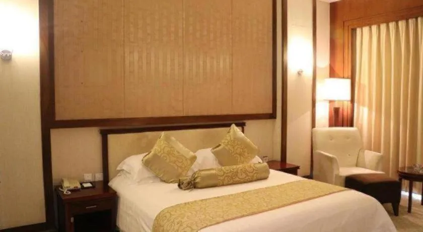 Bed in New Century Hotel Ninghai