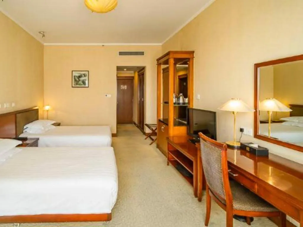 Bed in New Century Hotel Ninghai