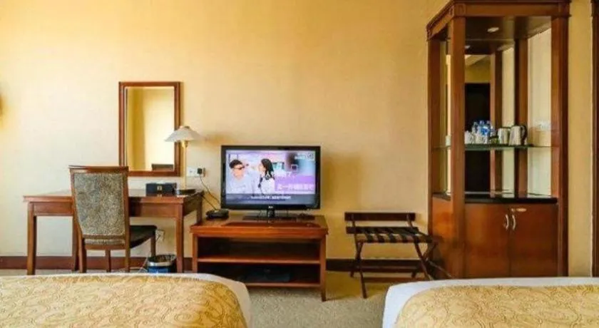 Bed in New Century Hotel Ninghai