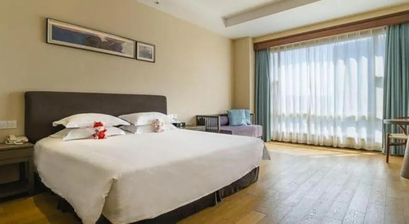 Bed in New Century Hotel Ninghai