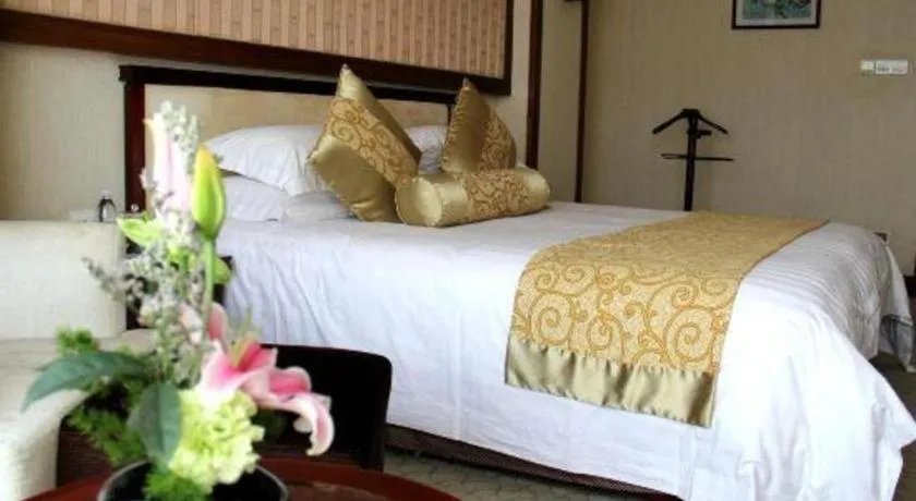 Bed in New Century Hotel Ninghai