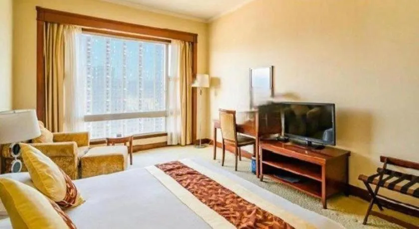 Bed in New Century Hotel Ninghai