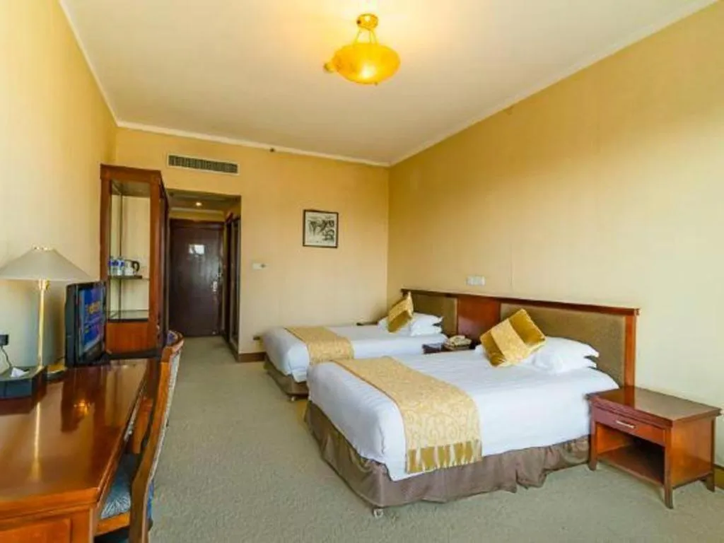 Bed in New Century Hotel Ninghai