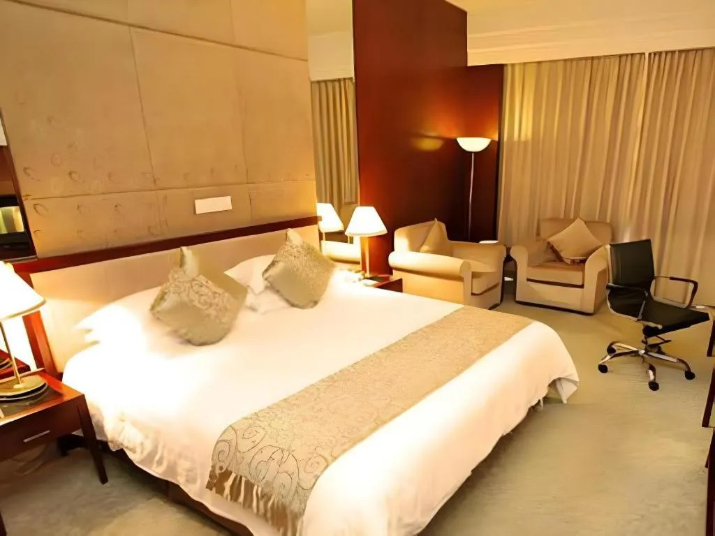 Bed in New Century Hotel Ninghai