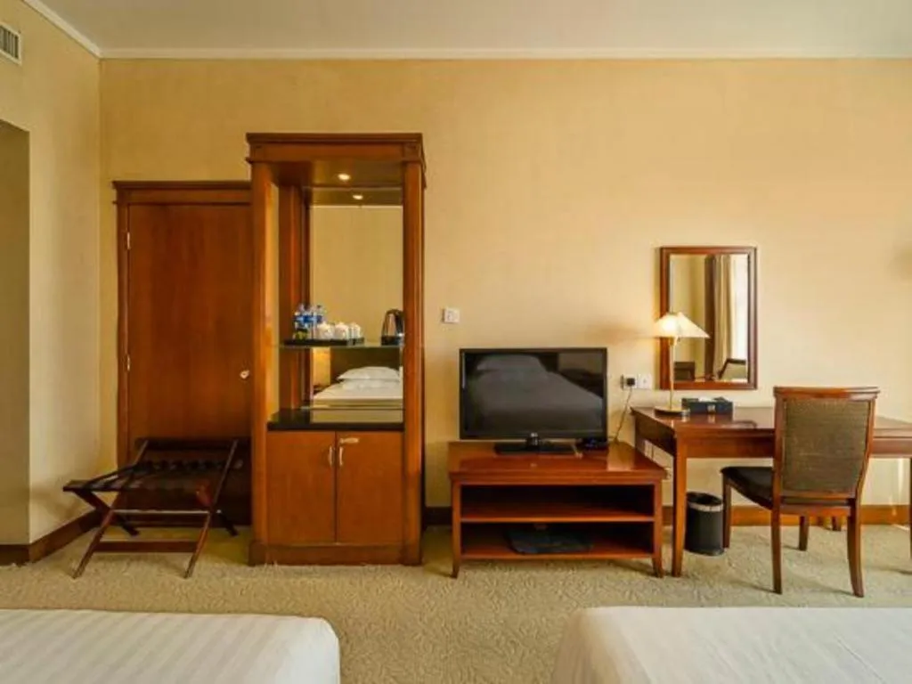 Bed in New Century Hotel Ninghai