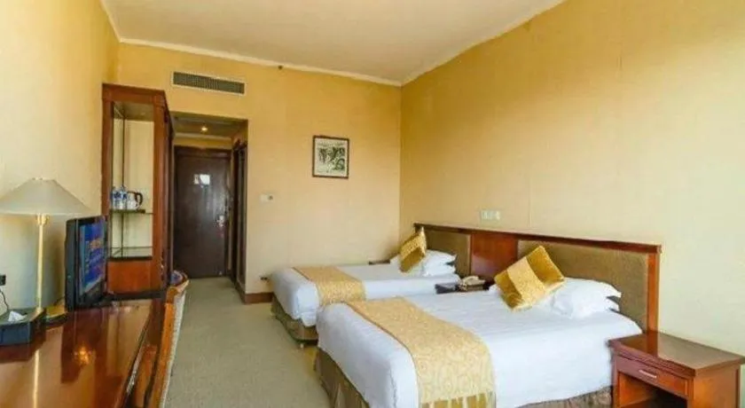 Bed in New Century Hotel Ninghai