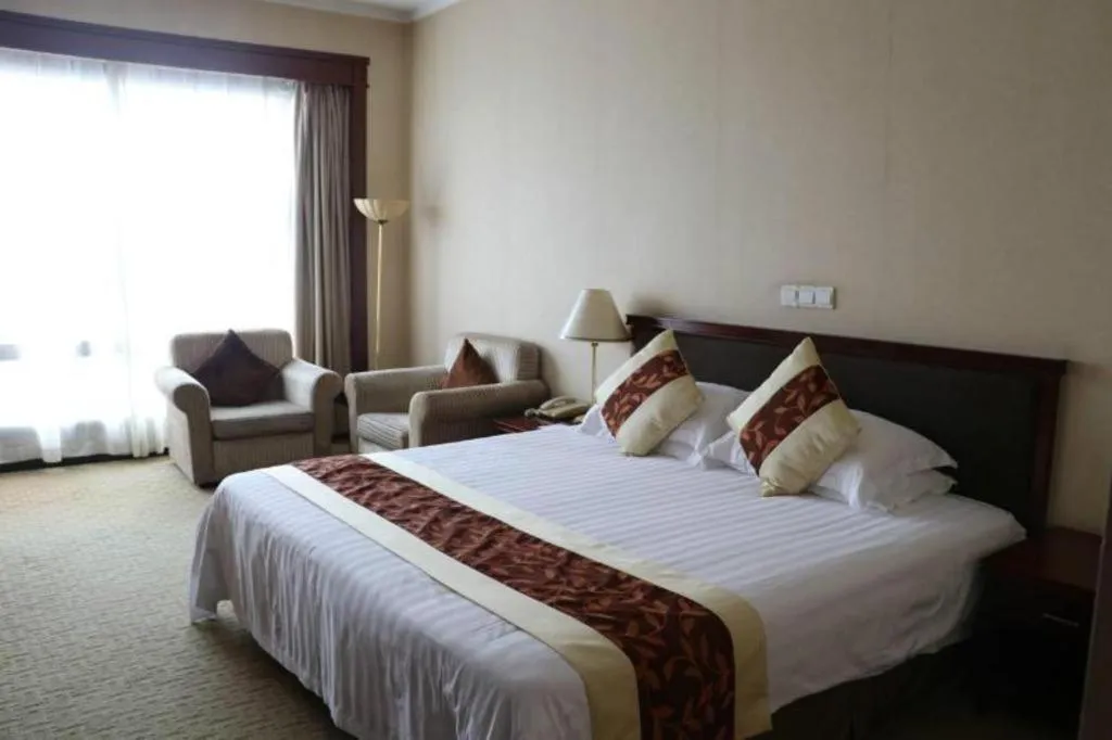 Bed in New Century Hotel Ninghai