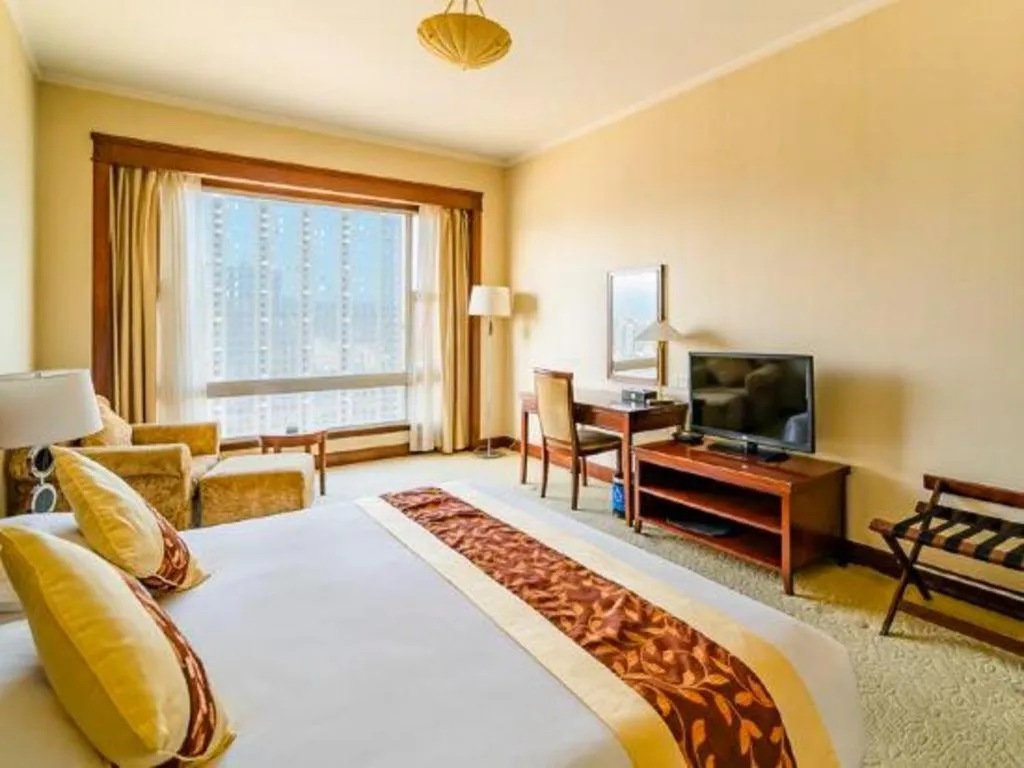 Bed in New Century Hotel Ninghai
