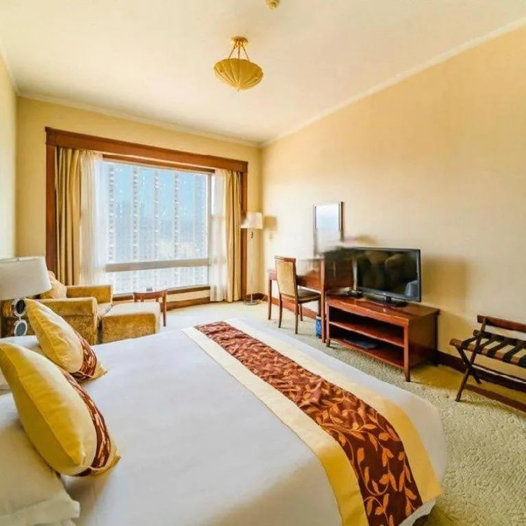 Bed in New Century Hotel Ninghai