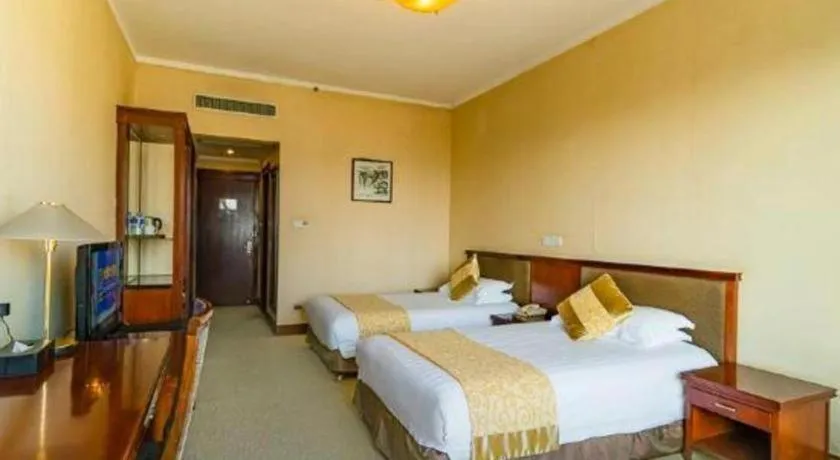 Bed in New Century Hotel Ninghai