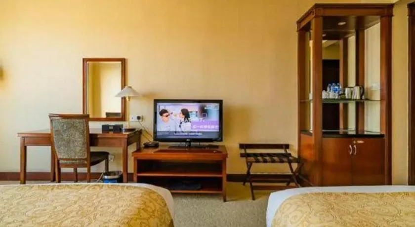 Bed in New Century Hotel Ninghai