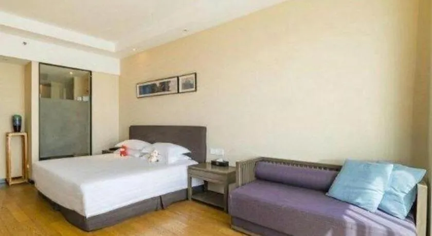 Bed in New Century Hotel Ninghai