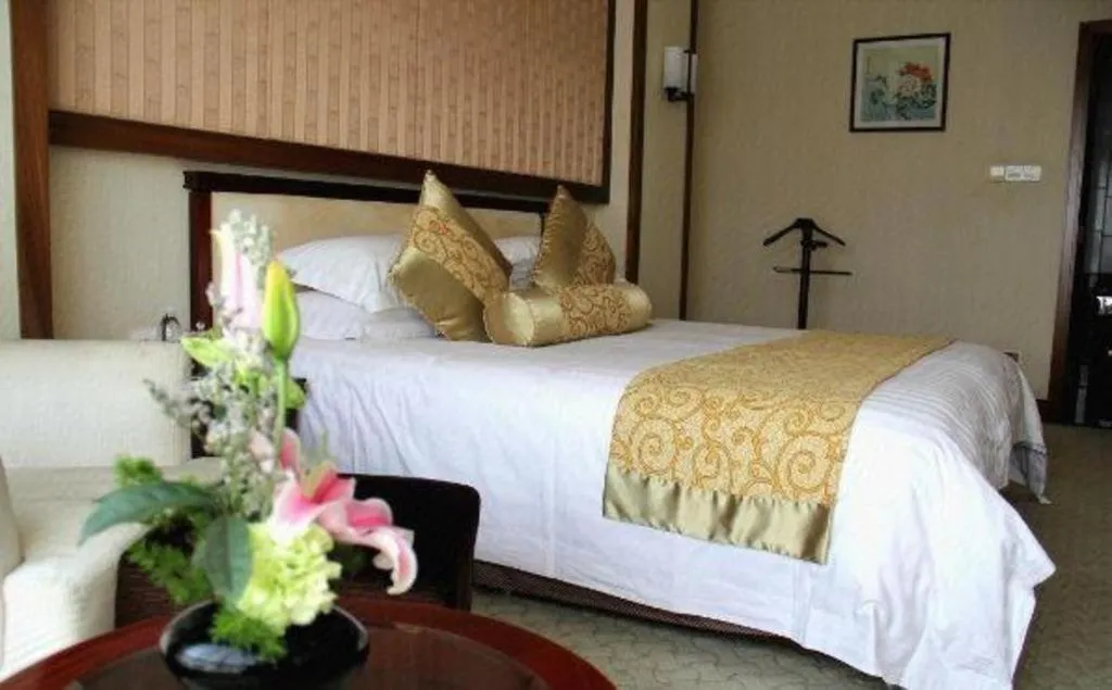 Bed in New Century Hotel Ninghai