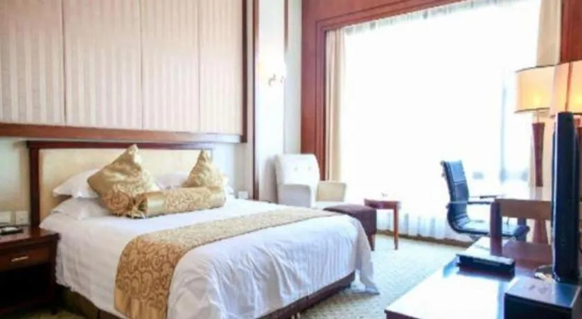 Bed in New Century Hotel Ninghai
