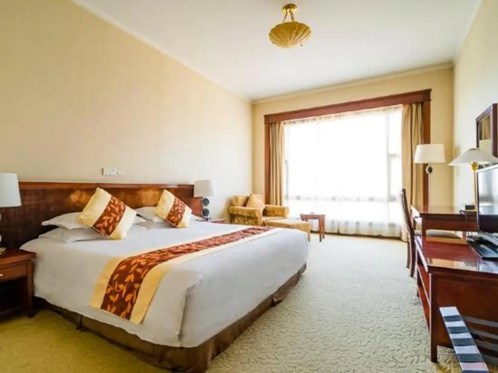 Bed in New Century Hotel Ninghai