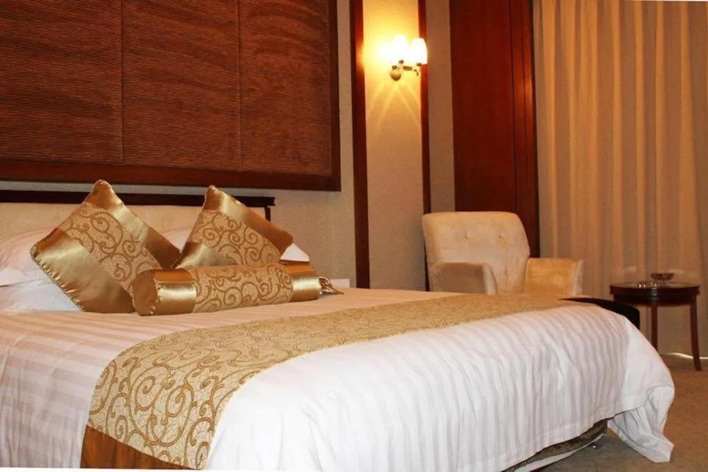 Bed in New Century Hotel Ninghai