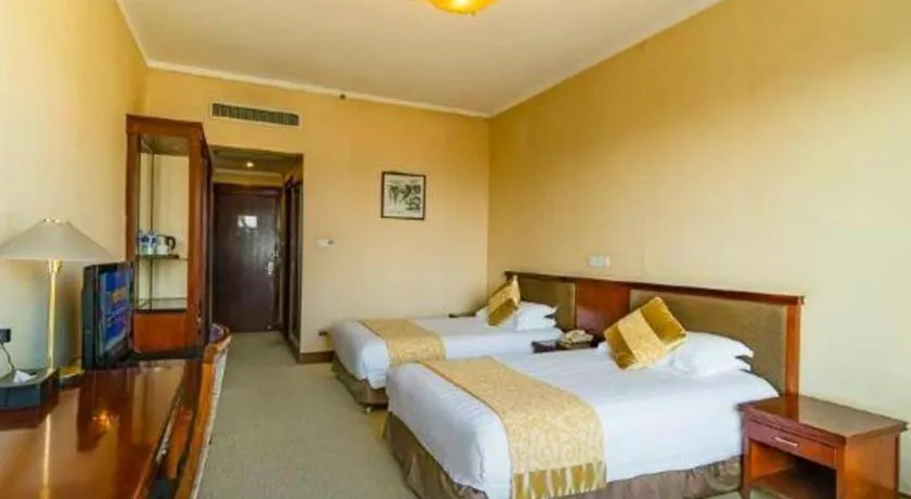 Bed in New Century Hotel Ninghai