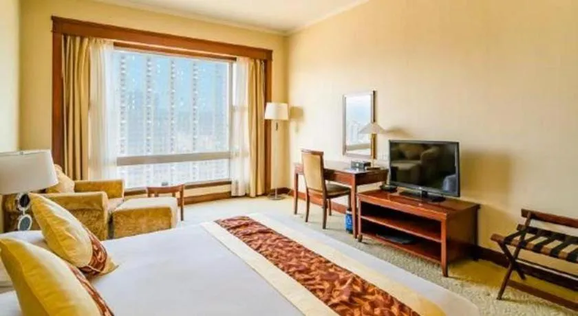 Bed in New Century Hotel Ninghai