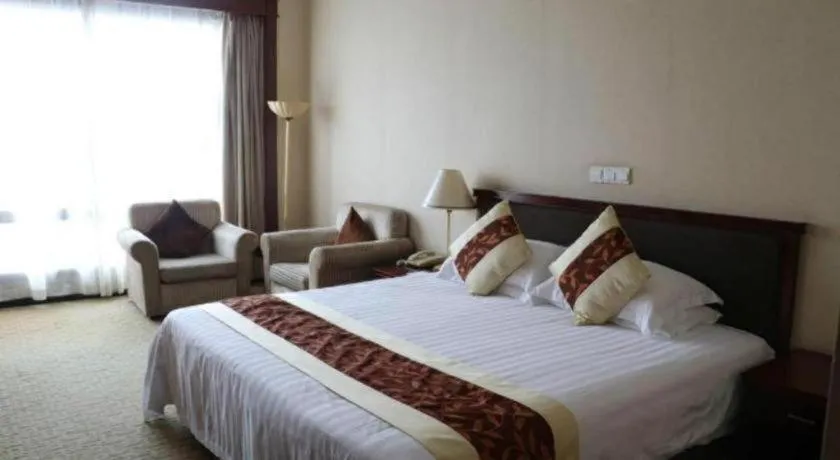 Bed in New Century Hotel Ninghai