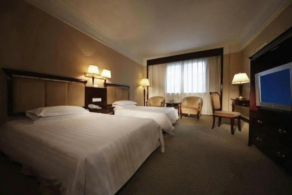 Bed in New Century Hotel Taizhou