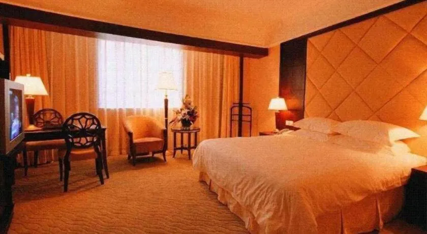 Bed in New Century Hotel Taizhou