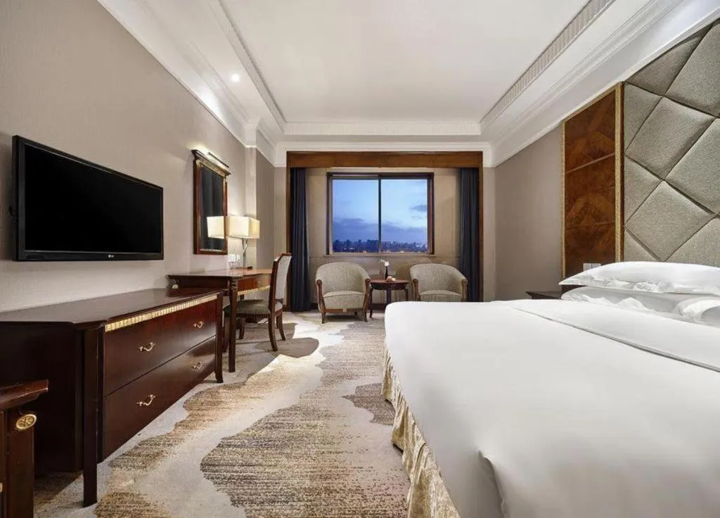 Bed in New Century Hotel Taizhou