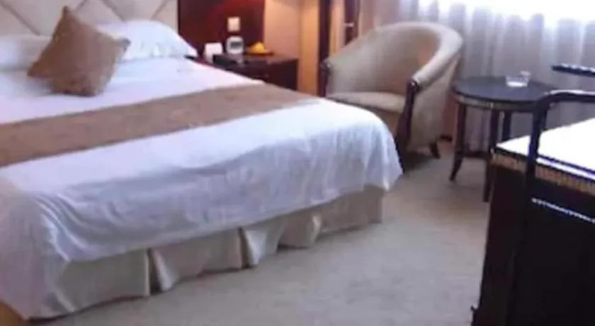 Bed in New Century Hotel Taizhou