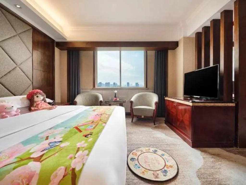 Bed in New Century Hotel Taizhou