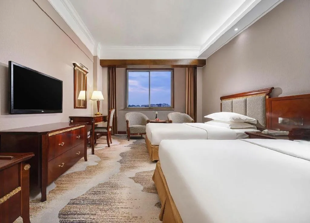 Bed in New Century Hotel Taizhou