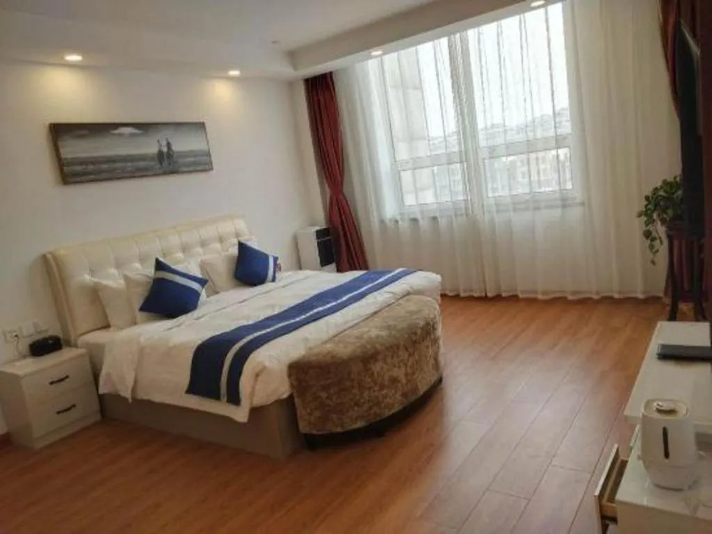 Bed in New Century Grand Changchun Hotel