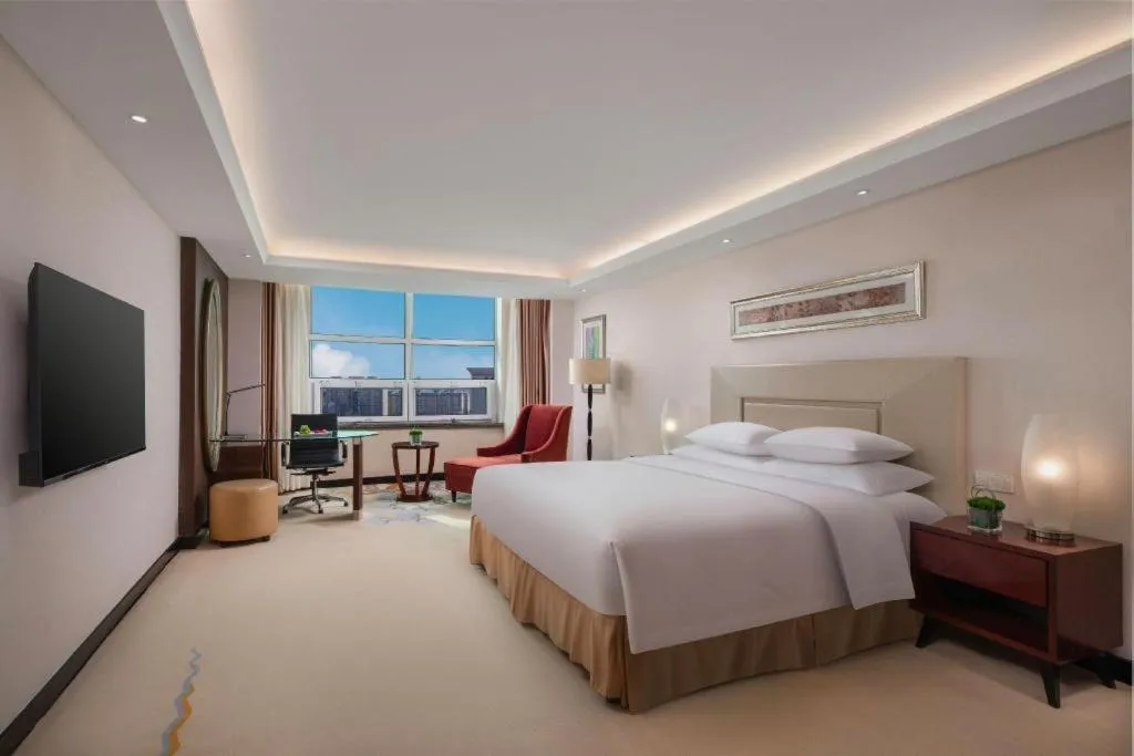 Bed in New Century Grand Changchun Hotel