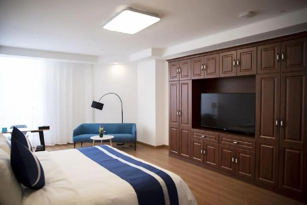 Bed in New Century Grand Changchun Hotel