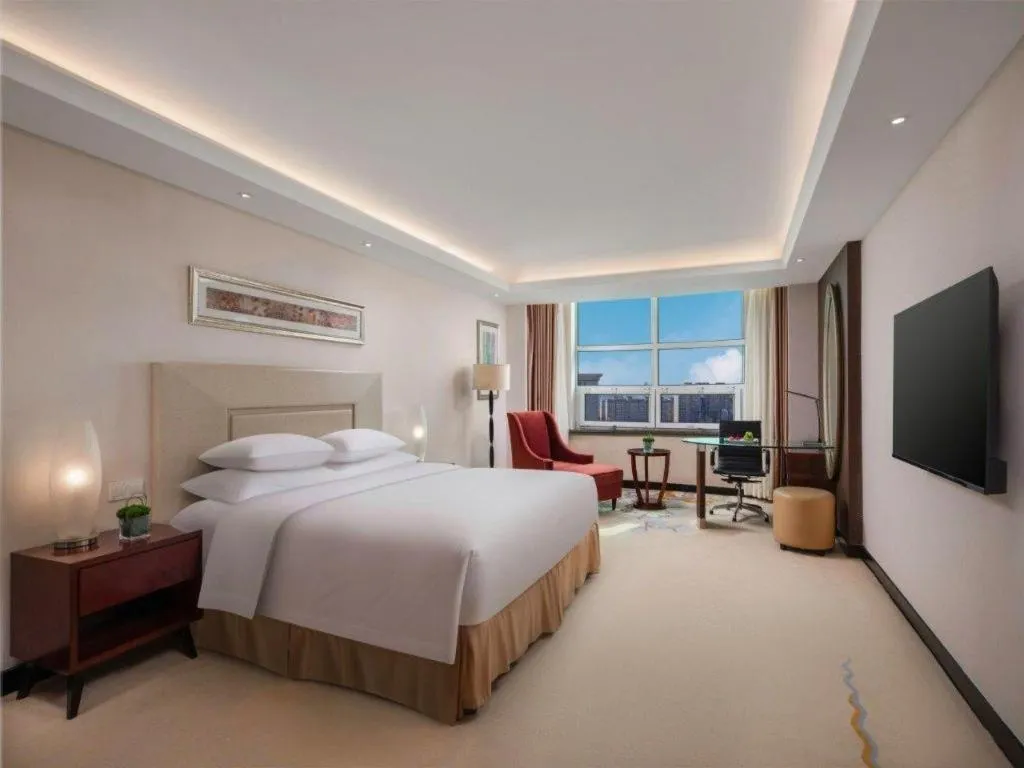 Bed in New Century Grand Changchun Hotel